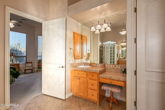 bathroom featuring tile patterned floors, ceiling fan, and vanity