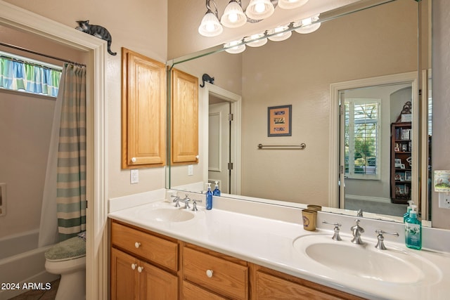 full bathroom with shower / bath combo, vanity, and toilet