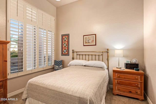 bedroom featuring light tile patterned floors