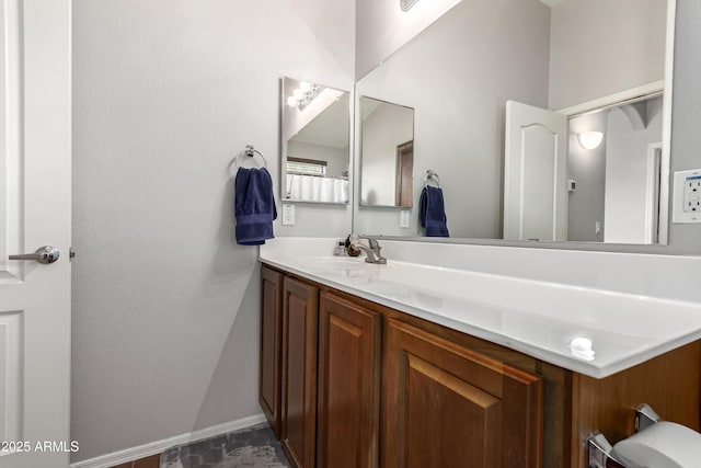 bathroom featuring vanity and baseboards