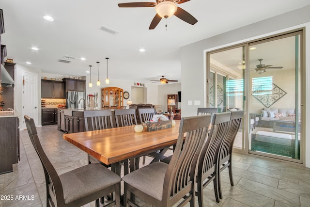 dining room with recessed lighting and visible vents