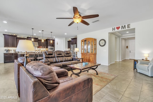 living room with visible vents, recessed lighting, baseboards, and ceiling fan