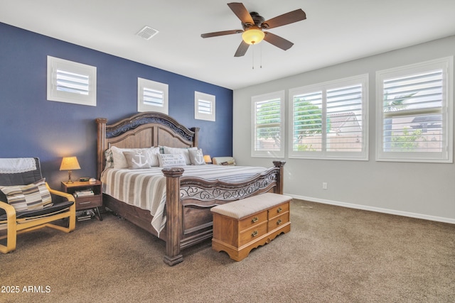 carpeted bedroom with visible vents, ceiling fan, and baseboards