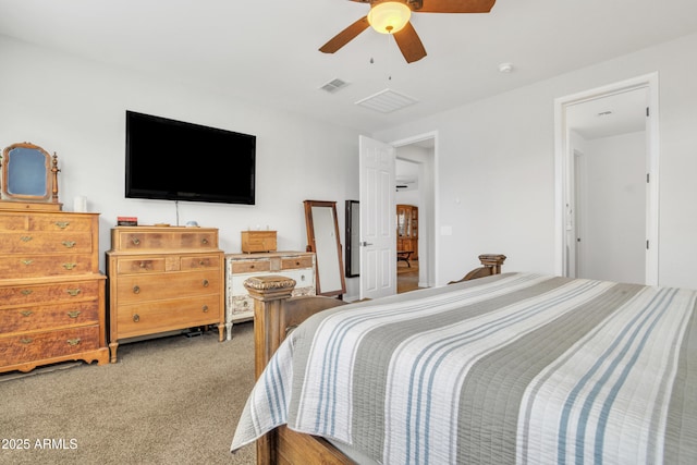 carpeted bedroom featuring visible vents and ceiling fan