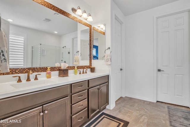 bathroom with a sink, backsplash, double vanity, and a shower stall