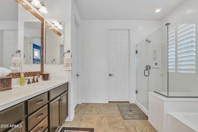 full bath with vanity, decorative backsplash, a bath, and a stall shower