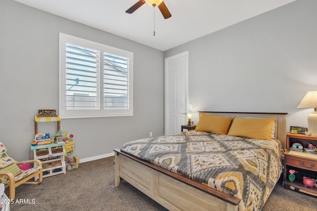 bedroom featuring baseboards, carpet floors, and a ceiling fan