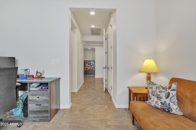 corridor with visible vents and baseboards