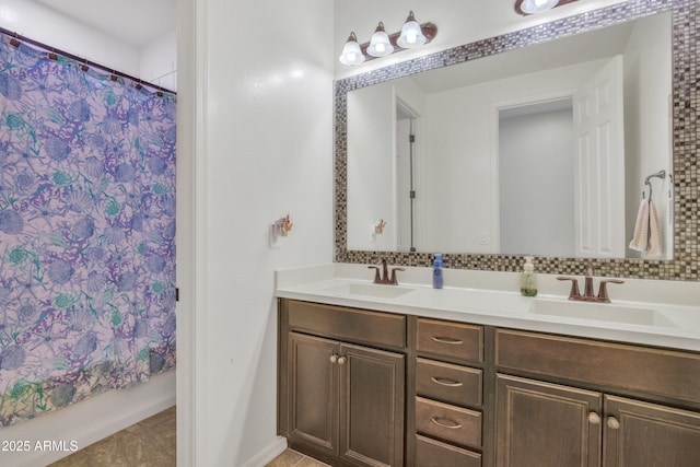 bathroom with a sink, a shower with curtain, and double vanity