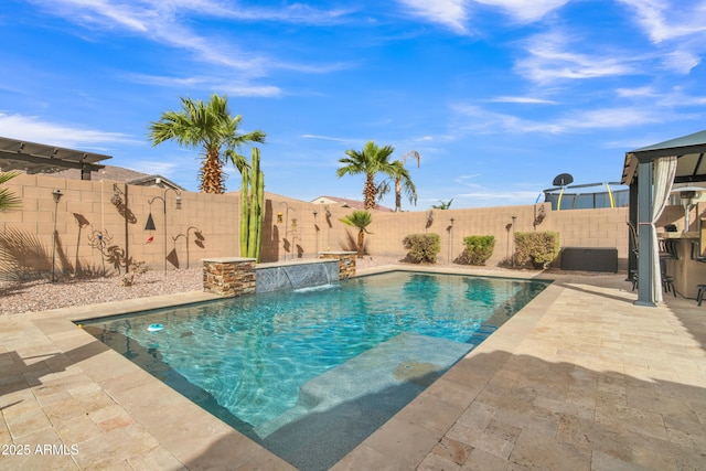 view of swimming pool with a patio, a fenced backyard, and a fenced in pool