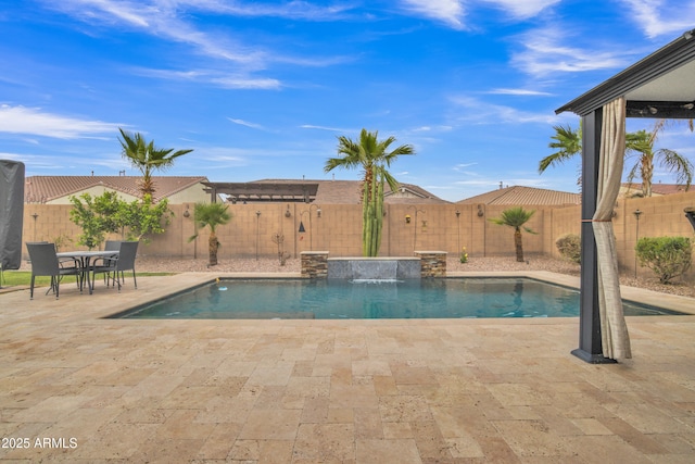 view of pool with a fenced in pool, outdoor dining area, a fenced backyard, and a patio area