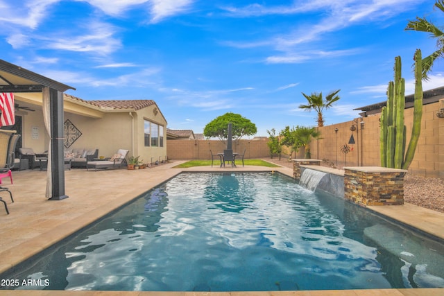 view of pool featuring a fenced in pool, a fenced backyard, outdoor lounge area, and a patio area