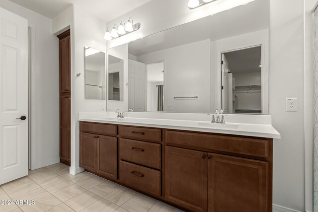 bathroom with vanity and tile patterned flooring