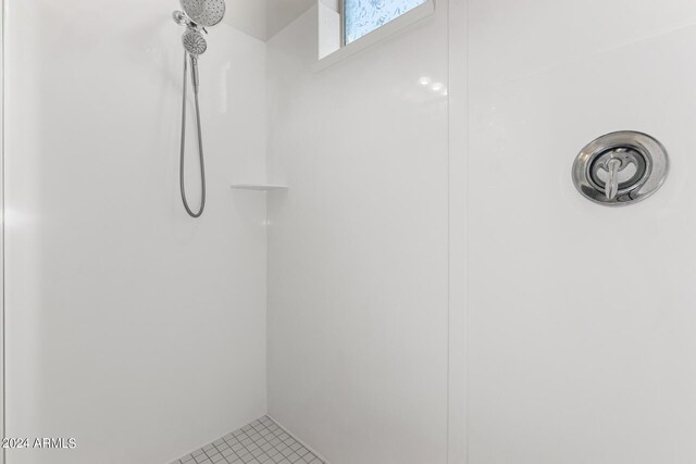 interior space featuring walk in shower and tile patterned floors