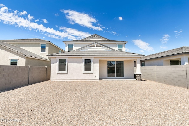 back of property featuring a patio