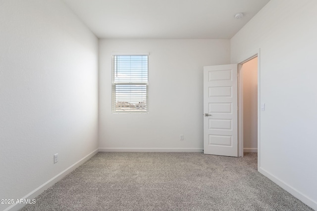 empty room featuring carpet flooring