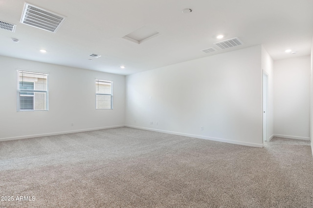 unfurnished room with light colored carpet