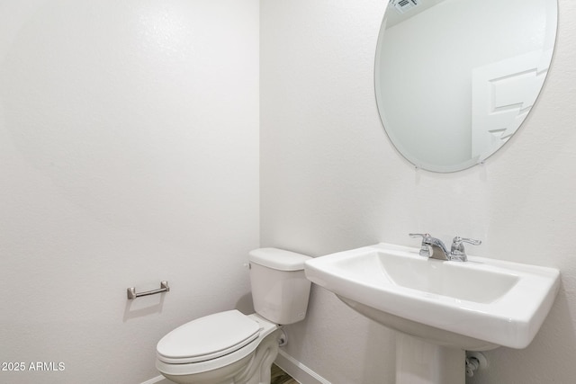 bathroom with sink and toilet