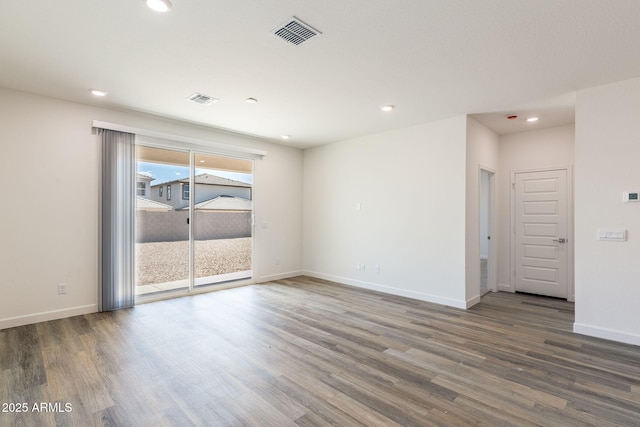 empty room with dark wood-type flooring