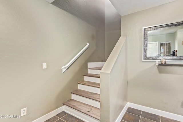 12517 W Santa Fe Ln, El Mirage, AZ 85335 - staircase featuring baseboards and tile patterned flooring