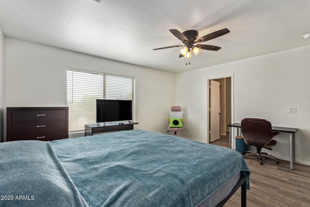 12517 W Santa Fe Ln, El Mirage, AZ 85335 - bedroom with wood finished floors, a ceiling fan, and baseboards