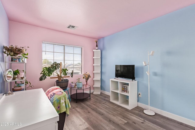 12517 W Santa Fe Ln, El Mirage, AZ 85335 - office area featuring wood finished floors, visible vents, and baseboards
