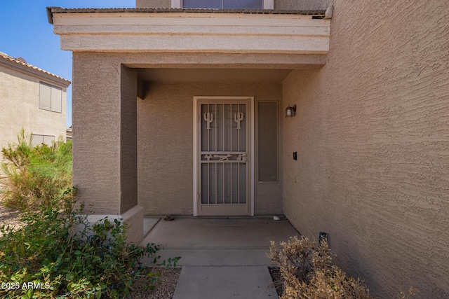 12517 W Santa Fe Ln, El Mirage, AZ 85335 - doorway to property featuring stucco siding
