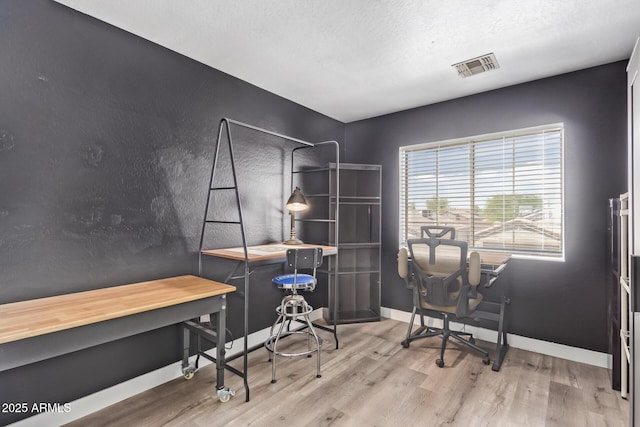 12517 W Santa Fe Ln, El Mirage, AZ 85335 - office area featuring baseboards, wood finished floors, and visible vents