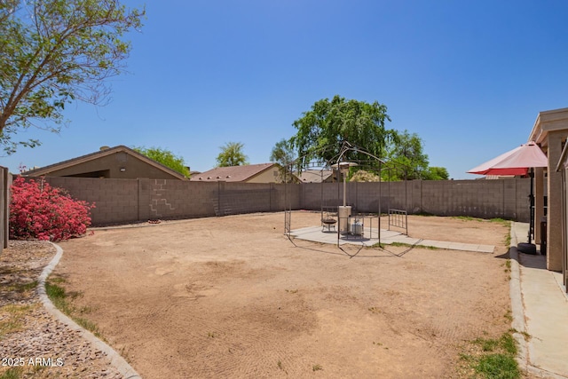 12517 W Santa Fe Ln, El Mirage, AZ 85335 - view of yard featuring a fenced backyard and a patio