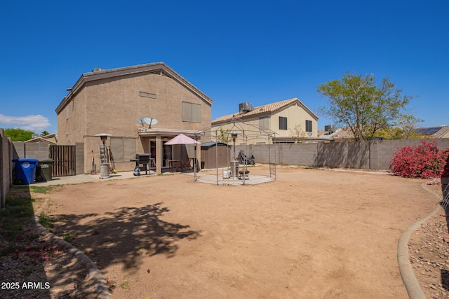 12517 W Santa Fe Ln, El Mirage, AZ 85335 - exterior space featuring a patio area and a fenced backyard