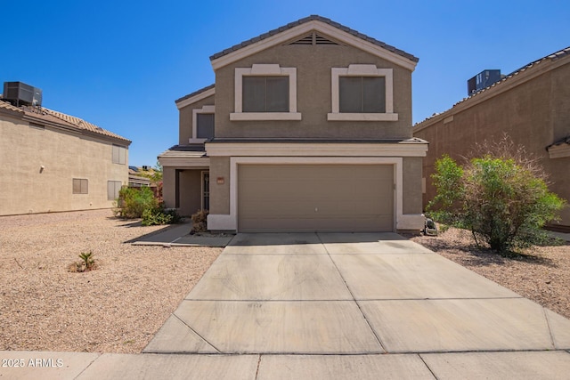 12517 W Santa Fe Ln, El Mirage, AZ 85335 - traditional-style house with a tiled roof, central air condition unit, stucco siding, driveway, and a garage