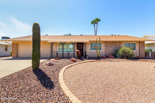 19402 N Welk Dr, Sun City, AZ 85373 - ranch-style house with a garage, brick siding, and driveway