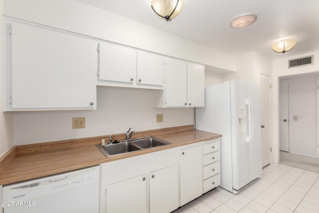 19402 N Welk Dr, Sun City, AZ 85373 - kitchen featuring white appliances, light countertops, white cabinets, visible vents, and a sink