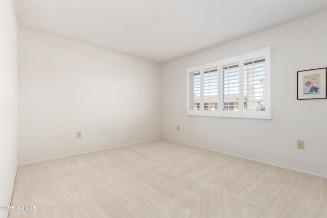 19402 N Welk Dr, Sun City, AZ 85373 - carpeted spare room featuring a textured ceiling and baseboards