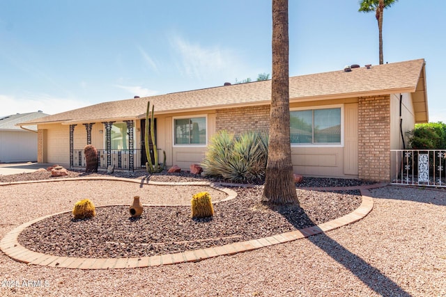 19402 N Welk Dr, Sun City, AZ 85373 - ranch-style house with an attached garage, driveway, fence, and brick siding