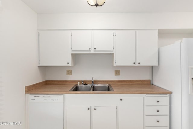 19402 N Welk Dr, Sun City, AZ 85373 - kitchen with light countertops, white cabinetry, a sink, and white appliances