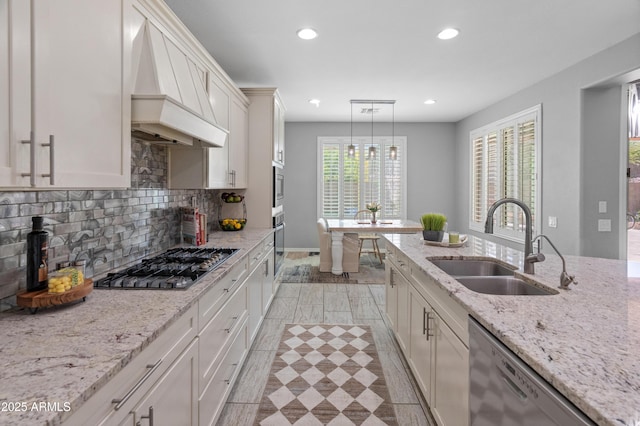 3603 E Salter Dr, Phoenix, AZ 85050 - kitchen featuring recessed lighting, custom exhaust hood, decorative backsplash, stainless steel appliances, and a sink