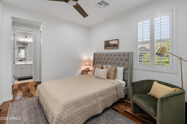 3603 E Salter Dr, Phoenix, AZ 85050 - bedroom with wood finished floors, ensuite bath, ceiling fan, baseboards, and visible vents
