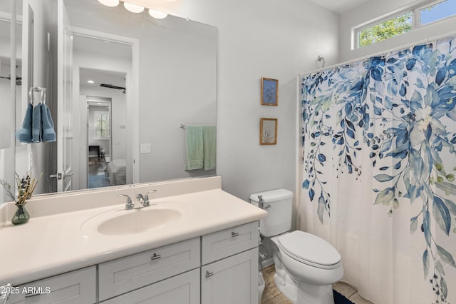 3603 E Salter Dr, Phoenix, AZ 85050 - full bathroom with curtained shower, toilet, and vanity