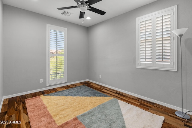3603 E Salter Dr, Phoenix, AZ 85050 - spare room featuring baseboards, visible vents, wood finished floors, and a ceiling fan