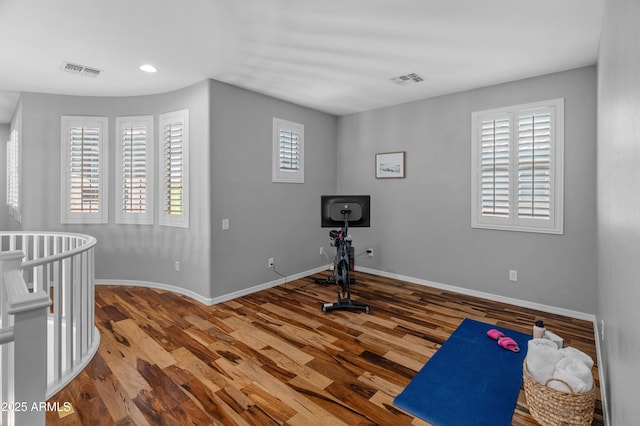 3603 E Salter Dr, Phoenix, AZ 85050 - workout area featuring baseboards, visible vents, wood finished floors, and recessed lighting