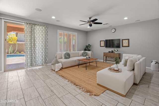3603 E Salter Dr, Phoenix, AZ 85050 - living room featuring baseboards, visible vents, a ceiling fan, and recessed lighting