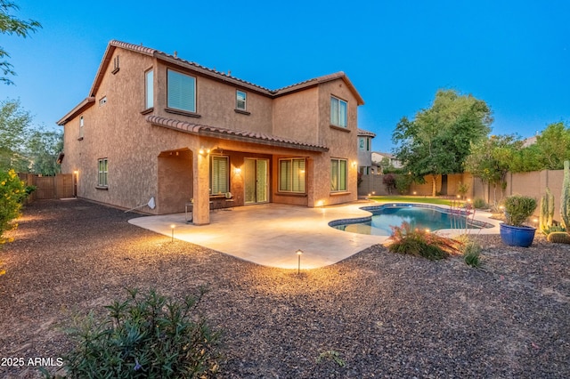 3603 E Salter Dr, Phoenix, AZ 85050 - back of property with a fenced backyard, stucco siding, a fenced in pool, a patio, and a tile roof