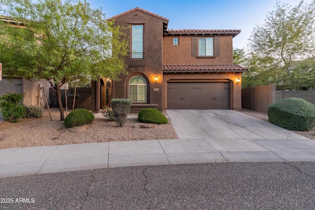 3603 E Salter Dr, Phoenix, AZ 85050 - mediterranean / spanish-style home with stucco siding, fence, a garage, a tile roof, and driveway