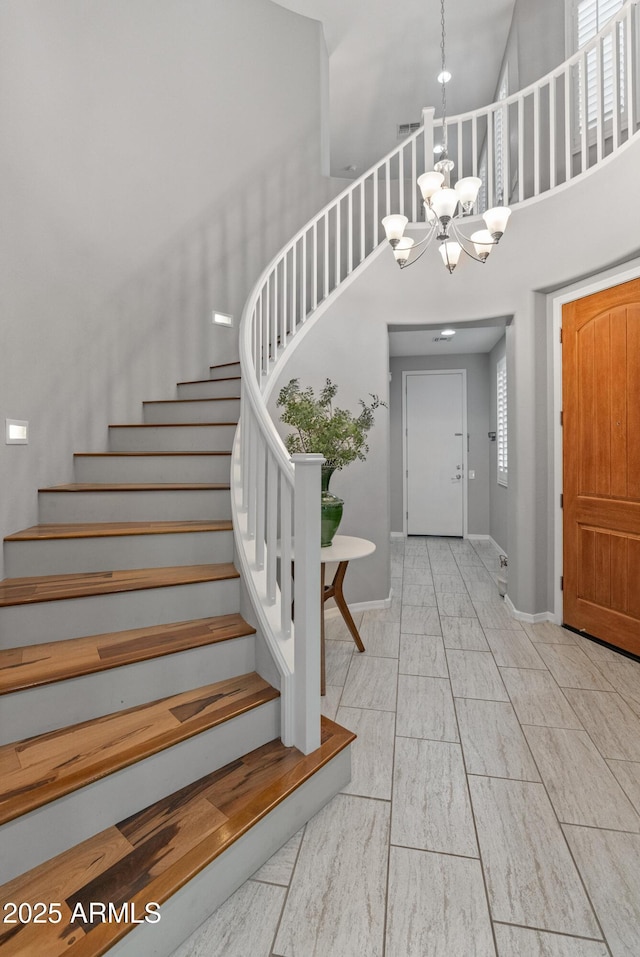 3603 E Salter Dr, Phoenix, AZ 85050 - entrance foyer with marble finish floor, stairway, a chandelier, and baseboards