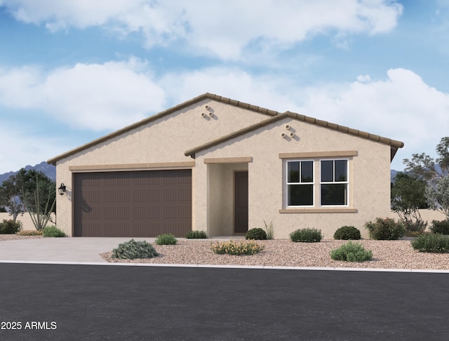 mediterranean / spanish-style house featuring a garage, driveway, and stucco siding