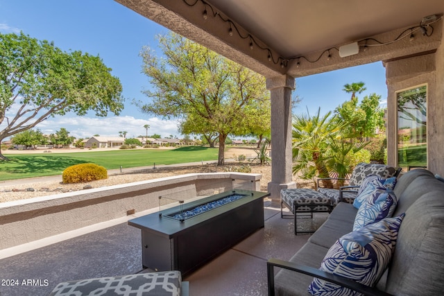 view of patio / terrace featuring an outdoor living space with a fire pit