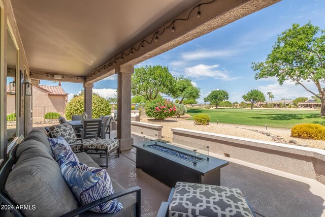 view of patio / terrace featuring an outdoor living space with a fire pit