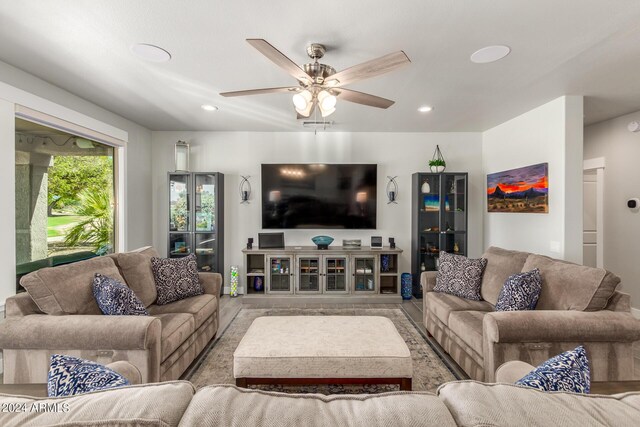 living room featuring ceiling fan