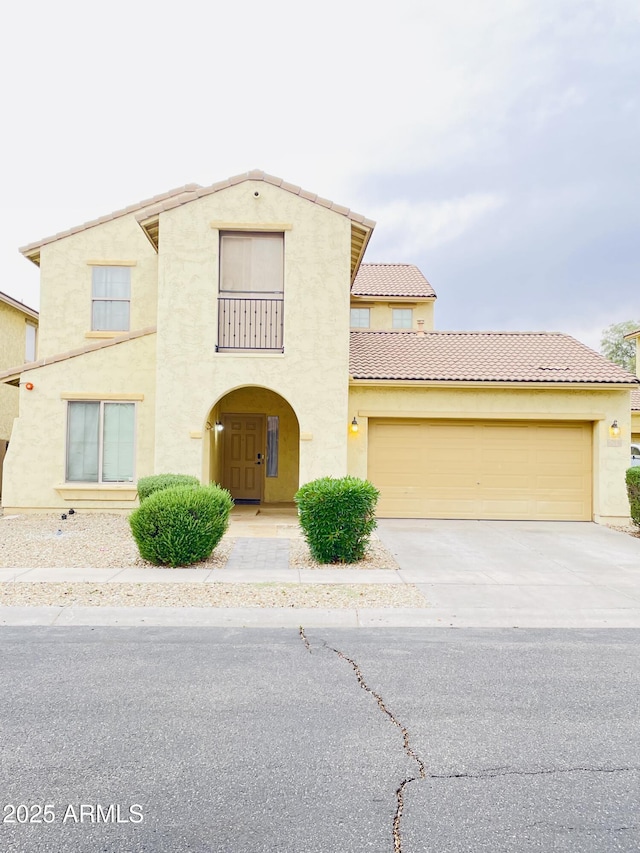 7136 N 73rd Dr, Glendale, AZ 85303 - view of front facade featuring a tile roof, driveway, a garage, and stucco siding